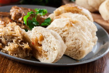 Pork loin in gravy with bread dumplings and sauerkraut