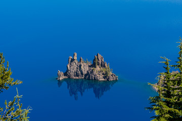 Phantom Ship Rock Through The Trees of Crater Lake
