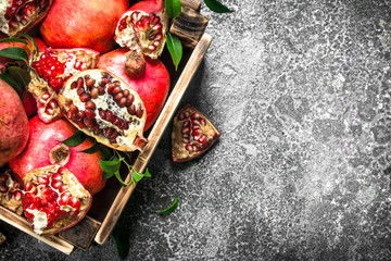 Ripe pomegranates in a box.