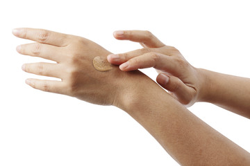 Liquid foundation on woman's hands isolated with clipping path.