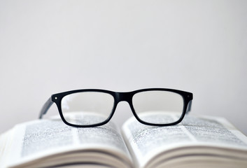 Eyeglasses on a translation book