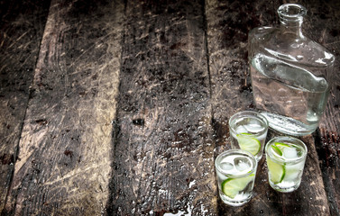 Vodka shots with ice and fresh lime.