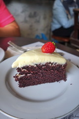 Chocolate cake with cream cheese topping and strawberry