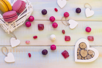 Woven heart with macaroons and candies