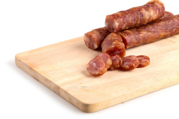 Chinese sausage and chinese sausage sliced for cook isolated on a white background