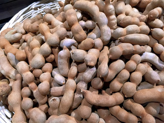 Pile of Sweet and Sour Tamarinds in Woven Basket