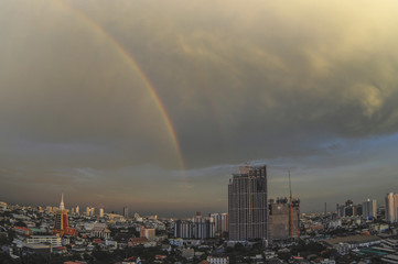 Rainbow over Bangkok and temple