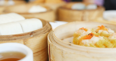 Eating steamed chinese dim sum in restaurant