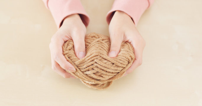 Woman hand holding knit wool
