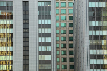 Fototapeta na wymiar Facades of Skyscrapers in Tokyo, Japan