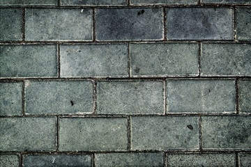 Pavement. Sidewalk tile background. Pavement tile. Top view. Closeup. Grunge background