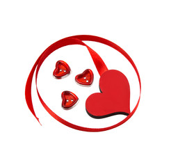 thin red satin ribbon is twisted and cut on white background buttons in the form of hearts