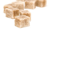 Cane sugar cubes on a white background