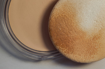 Female orange powder for the face. Cosmetics for beauty of a female face