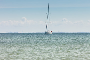 Fototapeta premium Yacht sail boat on calm sea water