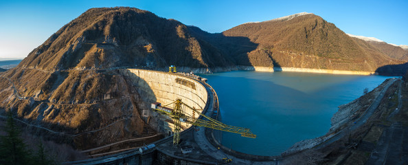 The Enguri hydroelectric power station HES. The Jvari Reservoir next to Inguri Dam, surrounded by mountains. Third highest concrete arch dam in the world. Georgia