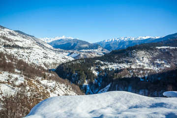 Fototapeta na wymiar Panoramic view on snow winter mountains. Caucasus Mountains. Svaneti region of Georgia