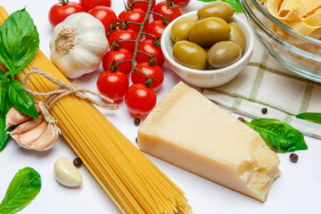 Fettuccine and spaghetti, vegetables with ingredients for cooking pasta