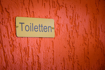 WC Toilette Toilet Schild an der Wand