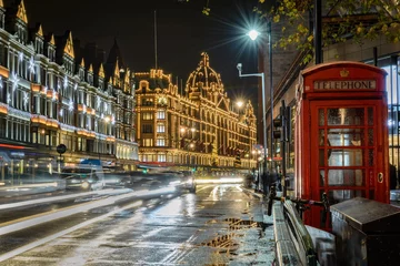 Gordijnen traffic jam in street of London at night during christmas holidays with a historical phone cab © alessandro zanarini