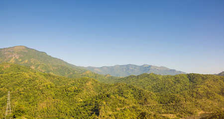 beautiful green mountains/Hills with blue sky background. Winter landscape season in asia Thailand.