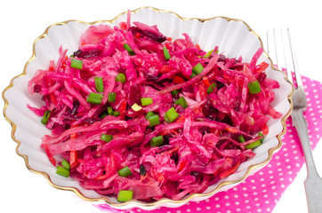 Vegetable salad with raw beets, carrots and cabbage