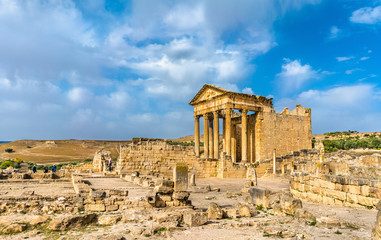 Fototapeta na wymiar The Roman Capitol at Dougga. UNESCO heritage site in Tunisia