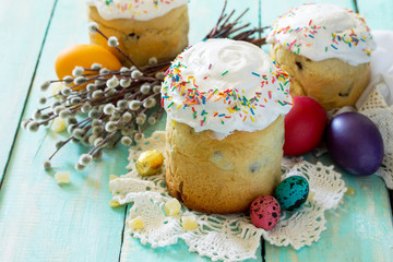 Easter background. Traditional food on the holiday table bread cake with   candied fruits and easter eggs. Easter recipe.