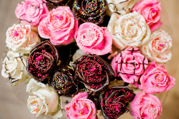 original bouquet of white, pink and chocolate roses, decorated with sugar powder
