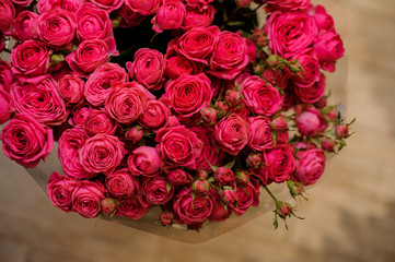 big bouquet of a lot of small roses of pink color close up