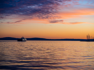 Ship sailing into the sunset