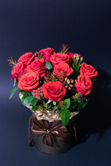 Vertical photo of the flowers bouquet on dark background