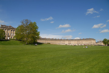 Fototapeta premium People relaxing on the lawn in front of The Royal Crescent, Bath, United Kingdom