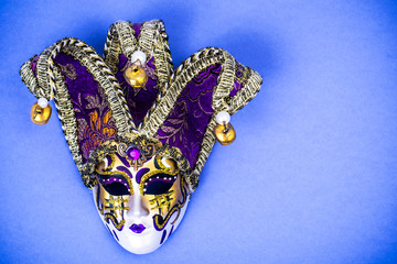 Mardi Gras Festival. Luxurious masquerade Venetian carnival mask on purple background