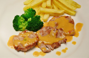 Pork Tenderloin menu with Champignon sause and French fries