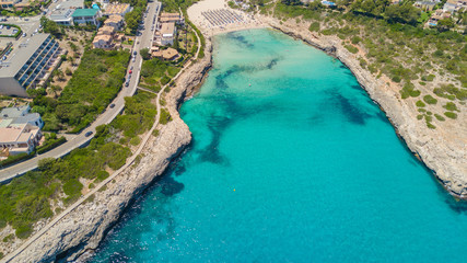 Drone aerial landscape of the beautiful bay of Cala Mandia with a wonderful turquoise sea, Porto Cristo, Majorca, Spain