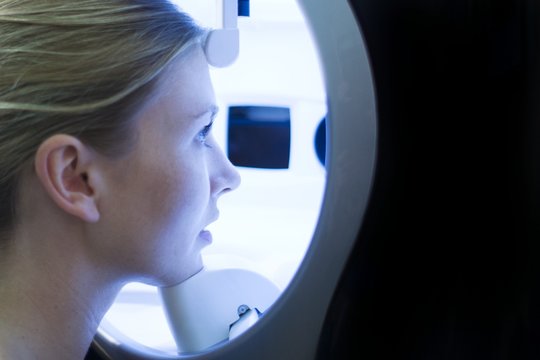Young woman undergoing examination in skin clinic