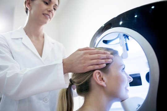 Young woman undergoing examination in skin clinic