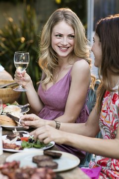 Woman Having Lunch Outdoors With Friends