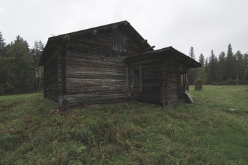 Old wooden house and farm buildings