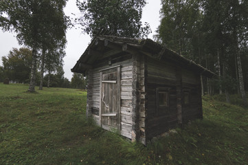 Old wooden house and farm buildings
