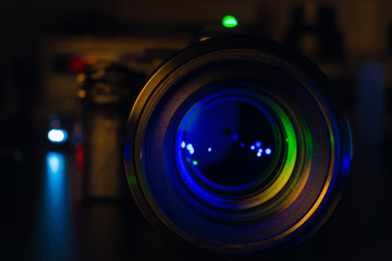 Fototapeta na wymiar Photo Camera or Video lens close-up on black background DSLR objective