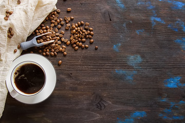 Italian homemade espresso coffee in a white mug. Dark background.