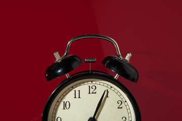 Part of a vintage clock on red background