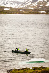 Fototapeta na wymiar People canoeing in lake