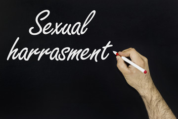 sexual harassment meme Text on blackboard.