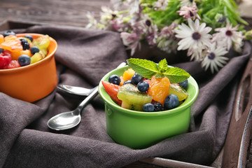 Dish with delicious fruit salad on tray