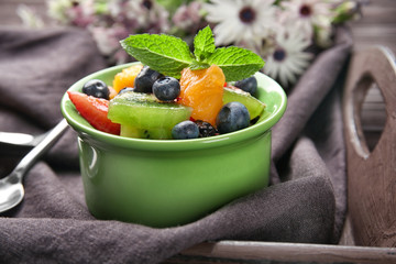 Dish with delicious fruit salad on tray