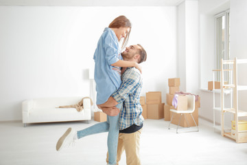 Young happy couple at new home