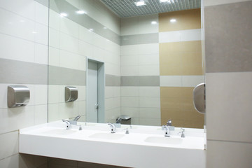Modern sinks with mirror in public toilet